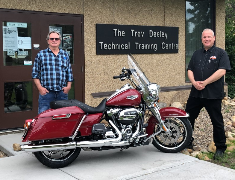 2020 winner Cal Worthing (L) received his new ride from GPRC Harley-Davidson® Technician instructor Peter Sellers.