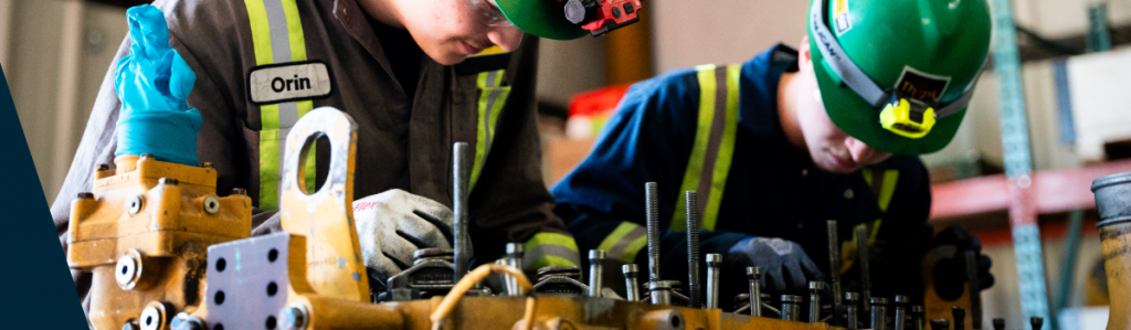 Heavy Equipment technician students working on equipment