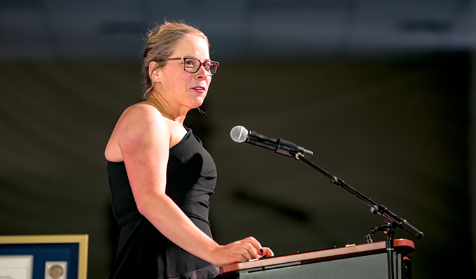 Image of Vanessa Sheane delivering her welcome address at the President's Ball